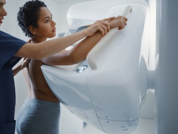 Woman getting mammogram done at doctor's office