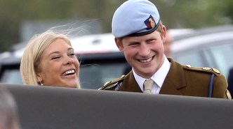 Prince Harry and Chelsy Davy laugh as they attend Prince Harry's Pilot Course Graduation at the Army Aviation Centre on May 7, 2010 in Andover, England.