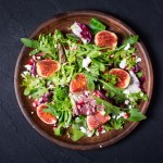 Autumn salad with arugula , spinach , figs and cheese