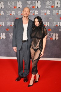 LONDON, ENGLAND - MARCH 01: (EDITORIAL USE ONLY) (EDITOR'S NOTE: Image contains partial nudity.) George Daniel and Charli XCX arrive at The BRIT Awards 2025 at The InterContinental London O2 on March 1, 2025 in London, England. (Photo by Jed Cullen/Dave Benett/Getty Images)