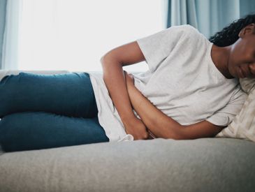 Black girl dealing with period cramps