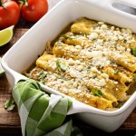 Chicken enchiladas baked with cheese in a casserole dish