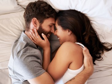 couple hugging in bed