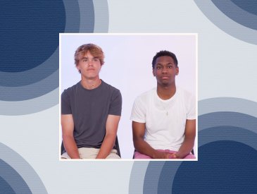 Two teen boys on colorful blue background.